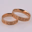 "Vyshyvanka" wedding rings with an ornament of coded words
