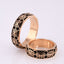 "Vyshyvanka" wedding rings with an ornament of coded words